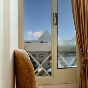 Deluxe Triple Room Pyramids view"